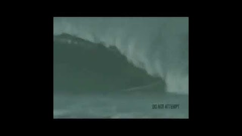 Man Surfs In Tsunami