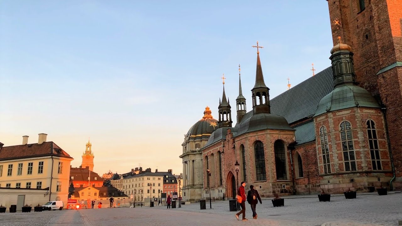 Stunning walk through Stockholm Old Town. Sunset sky and icy waters.  (treadmill, relax, explore)