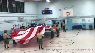 Troop 423 folding a giant flag