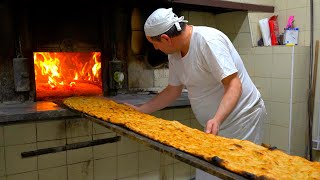 Twometer long pizzas baked in a centuryold woodfired oven!