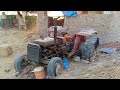 Old Tractor Working on Wheat Bhusa Press Machine