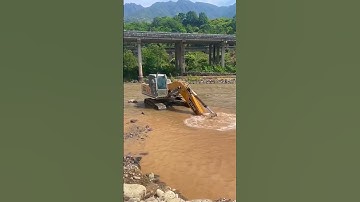 The process of deep excavation of river rock- Good tools and machinery make work easy