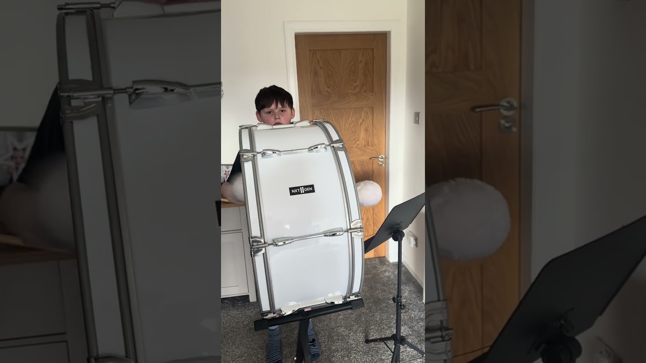 Playing bass drum for the pipe band