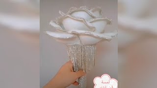 وردة جوريةمن ورق الفوم والالماز لمسة فن غدير A rose made of foam paper, holding a bride
