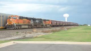 BNSF 7945 leads a northbound grain train through The Station at Central Park Moore, Ok July 30, 2020