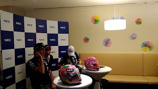 Force India drivers Sergio Perez and Esteban Ocon sign a fan's motorcycle helmet