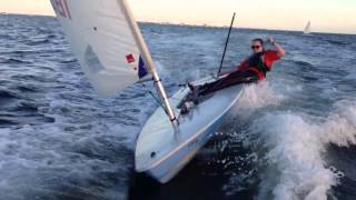 CATCHING A WAVE OF COACH BOAT ON A LASER