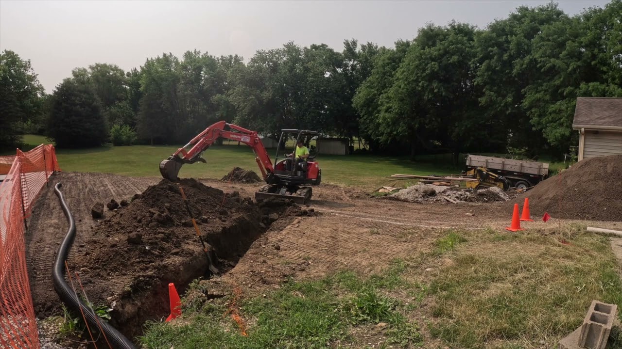 Buried Downspout Lines With a Kubota Kx71-3