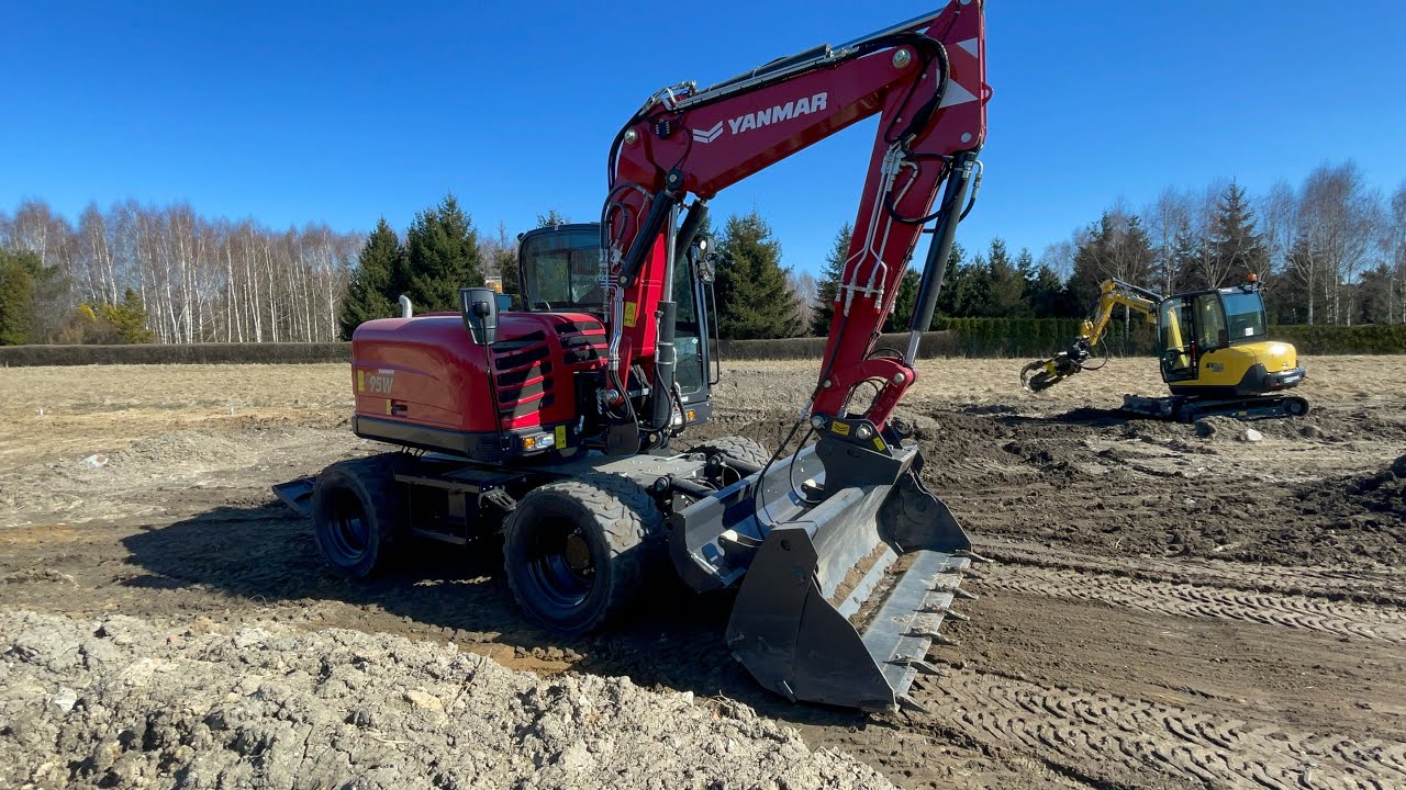 Jak pracować koparka kołowa z lyzka otwierana ??