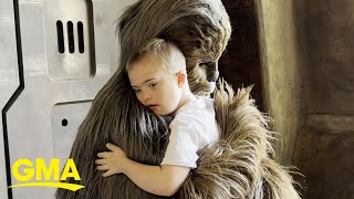 Young boy shares a sweet embrace with Chewbacca at Walt Disney World