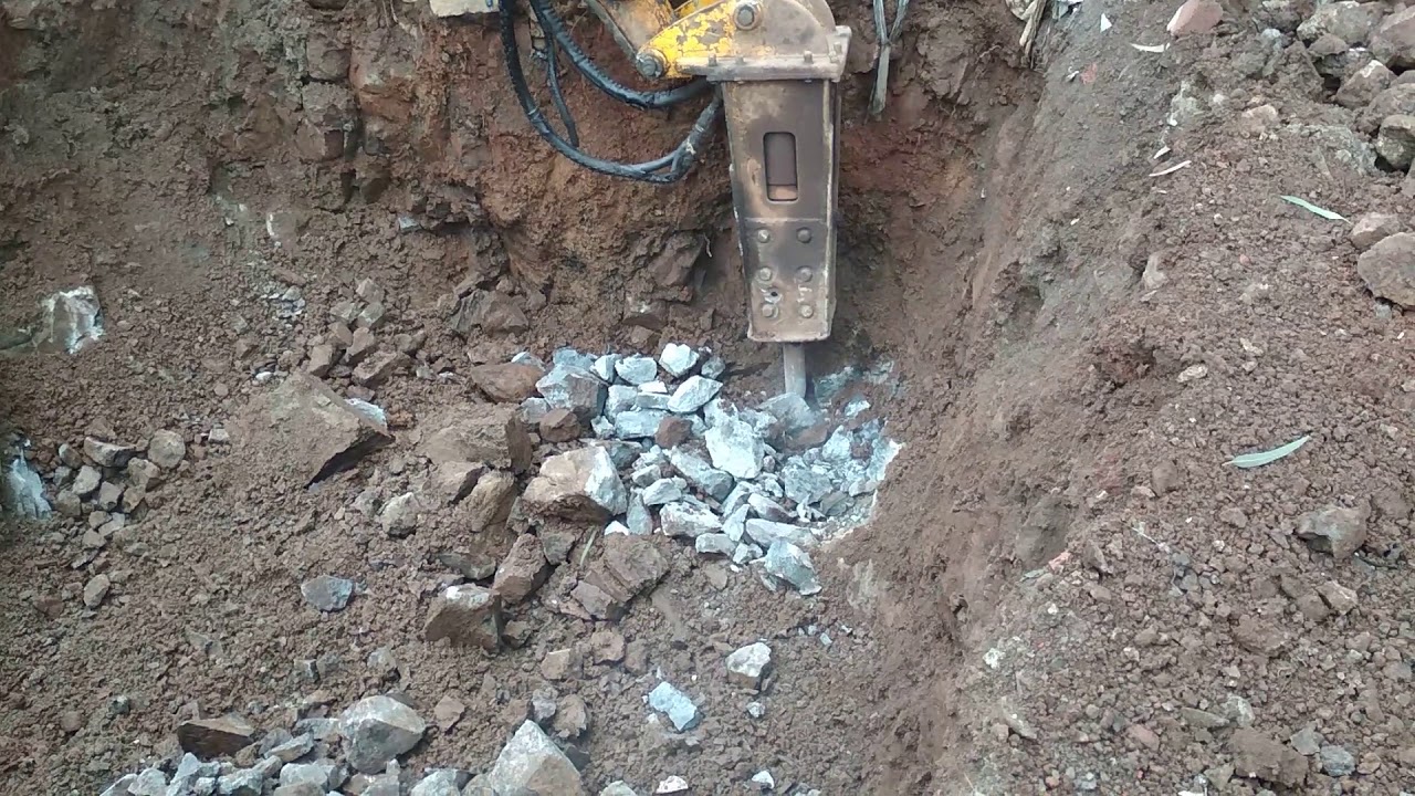 When stone in Footing.. How to remove stone with breaker machine JCB..