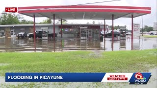 Tropical downpours cause widespread flooding in Picayune, MS