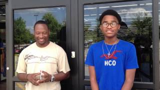 Sean Ingram at Walmart Fundraiser with student Aaron Saunders