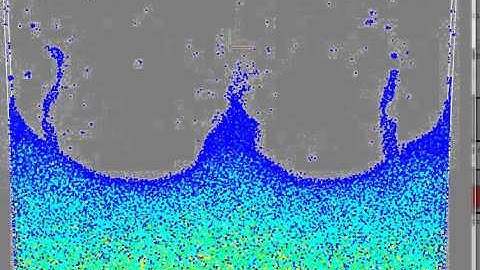 Drop of liquid falls into a volume of liquid.