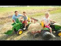 Using kids tractors to clean hay from barn and fields  tractors for kids