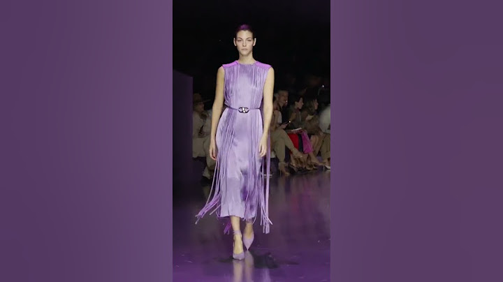 Dramatic silhouettes command attention on the runway.