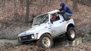 1987 Suzuki Samurai stuck in a creek