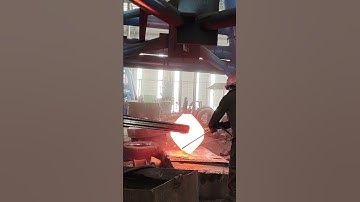 How to forge a rectangular iron block into a cylindrical iron block at high temperature.