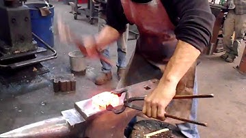 11. Brent hand forges pein on hammer