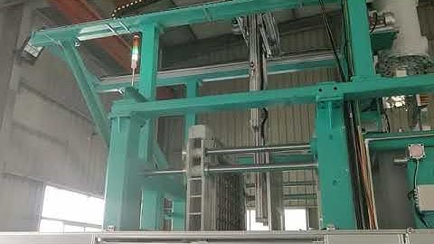 EPS SMED Shape moulding machine with robot arm to pick and stack products.