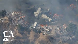 Firefighters are battling several growing blazes fueled by strong
santa ana winds. the most serious of fires burned multiple homes in
calimesa, forcing e...