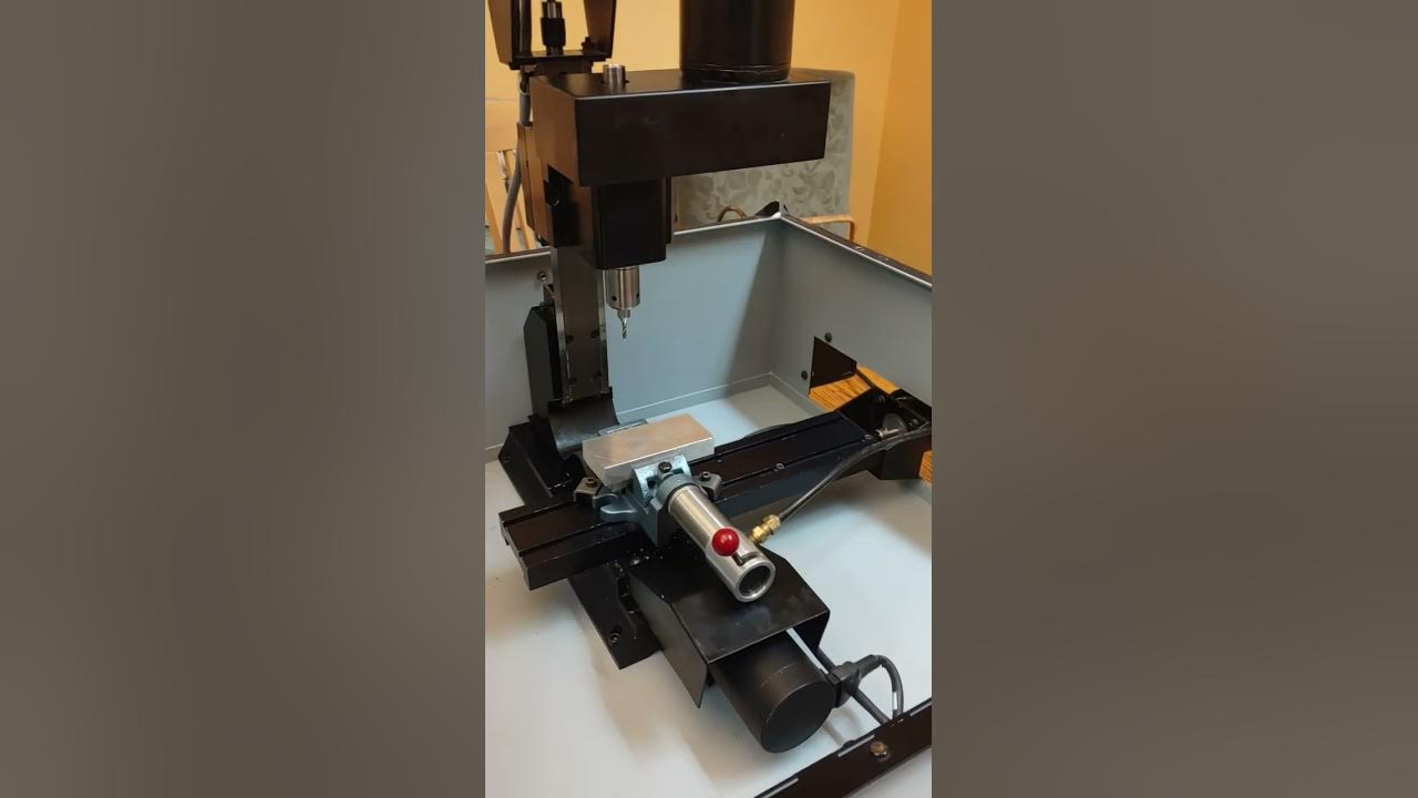This is a demonstration of a Light Machines Spectra Light cnc milling