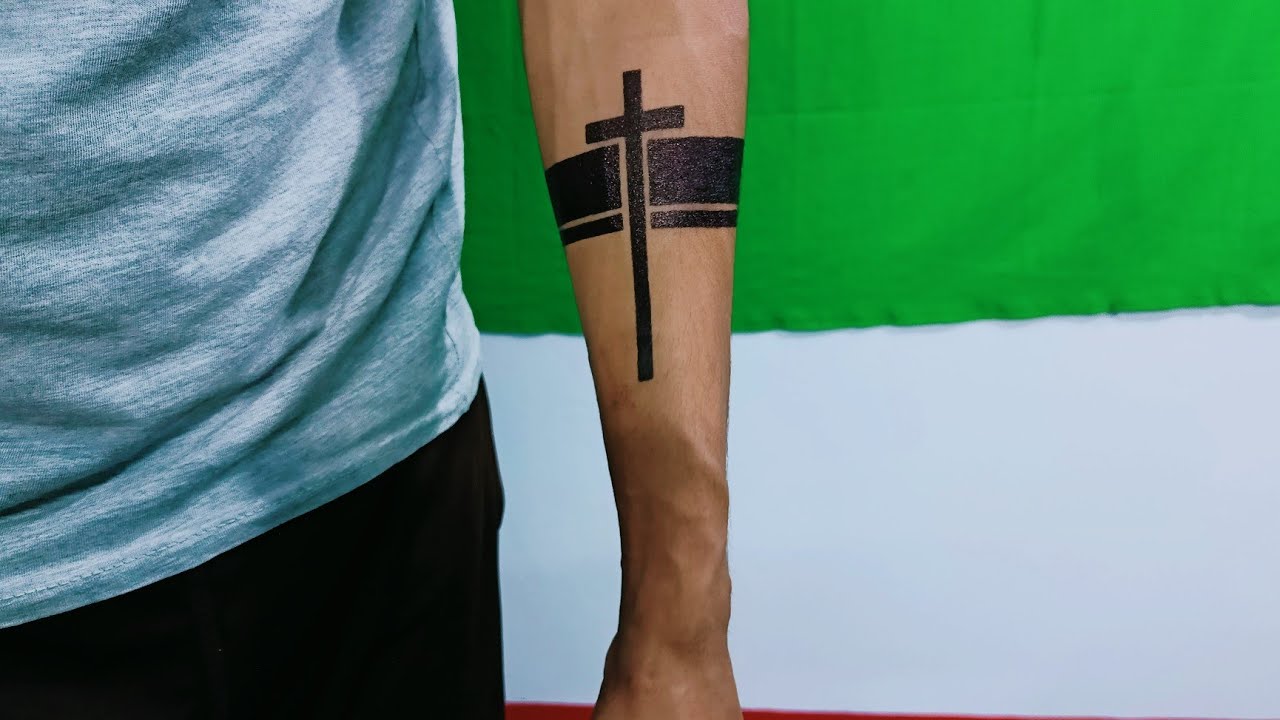 calf cross tattoo for women