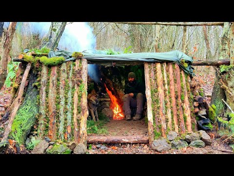 Bushcraft Shelter with Fireplace - Moss and wooden wall, Survival ...