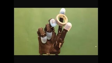 Experimental evaluation of synergy-based in-hand manipulation