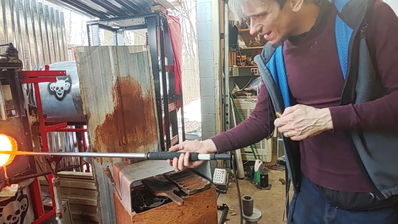 Blowing a simple glass cup.