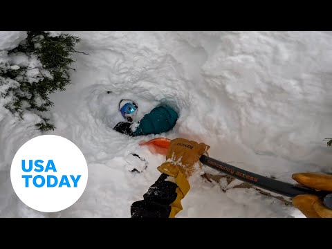 Snowboarder stuck deep in snow rescued by skier in Washington | USA TODAY