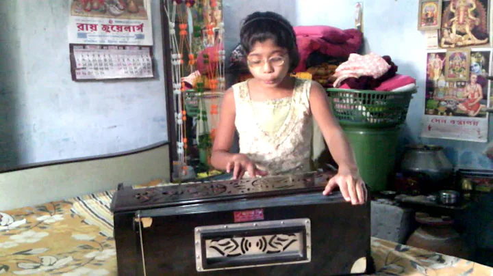 Shipra Chandra (Mou) plying harmonium