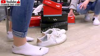 4K Girl Trying On Sneakers With Socks While Shopping For Shoes
