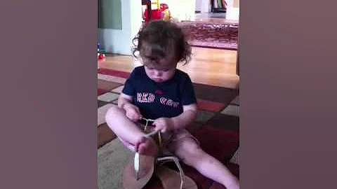 Safi tries on Laurie's sandals