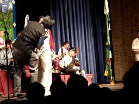 A boy and a girl singing a Tibetan duet song