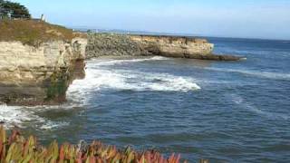 Waves reflecting off high cliff.