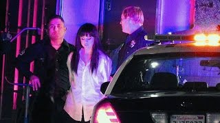 Selena gets thrown into the back of a cop car in her new video -- see
video!