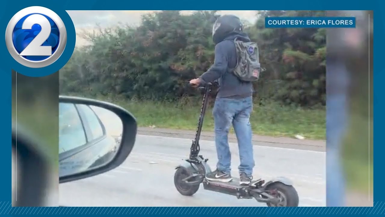 Electric scooter on freeway shocks and terrifies drivers of possible danger to himself and others
