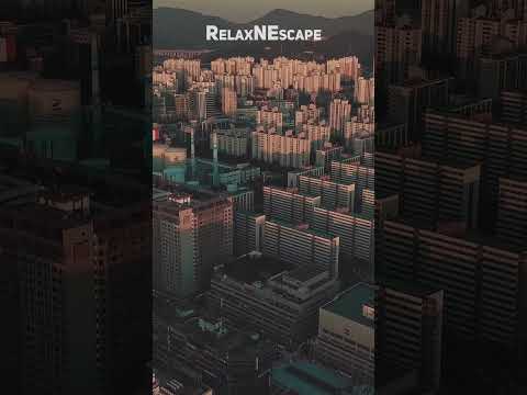 Urban Elevation: Aerial Drone Footage of Cityscape with Relaxing Music
