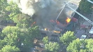 Firefighters battling a large fire at building in western Arlington