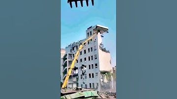 The process of demolishing a house = good machinery increases efficiency