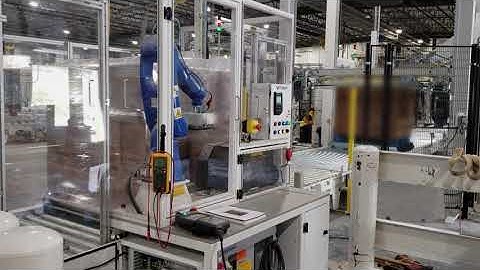 Robotic Printer Applicator on fully automated customer production line