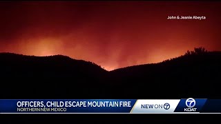 Four men, child escape massive fast moving forest fire