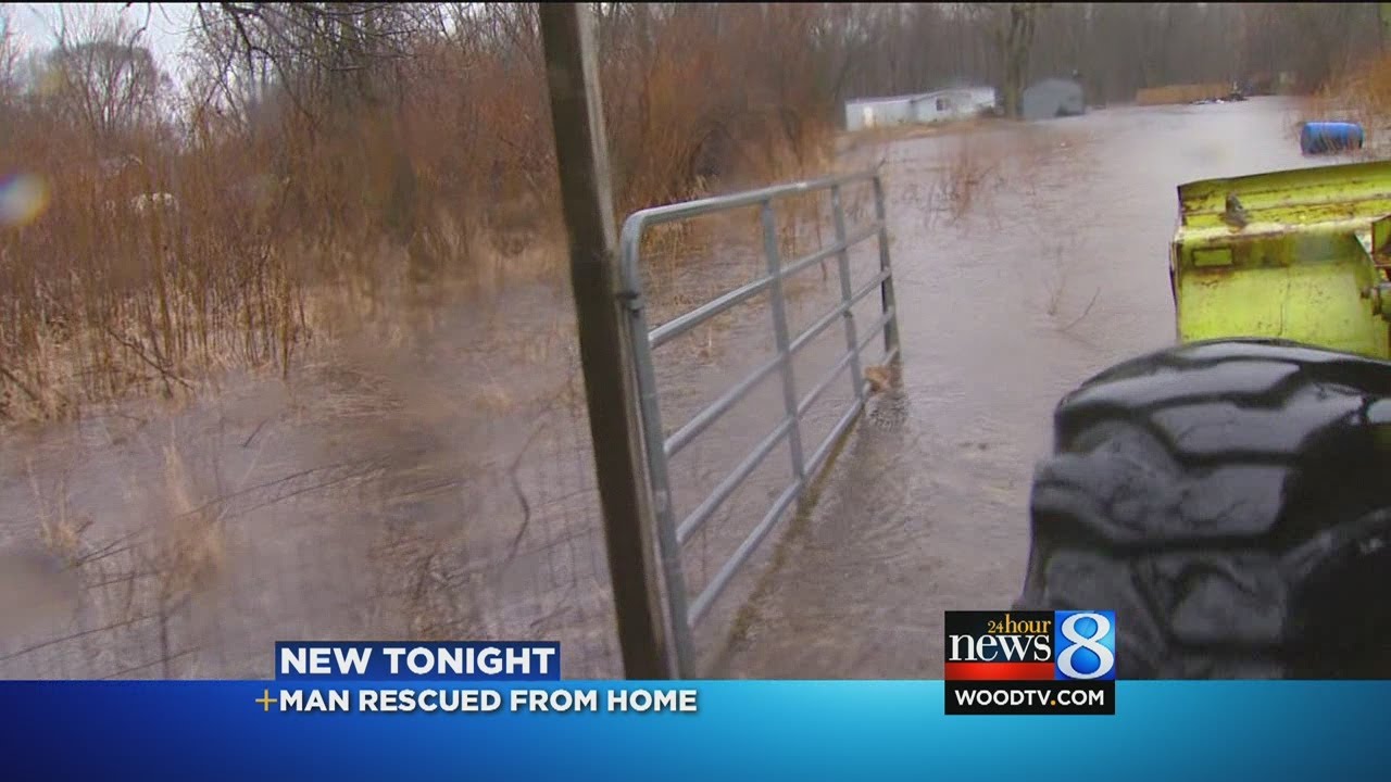 Man rescued from home in flooded area - YouTube