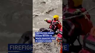 Firefighters brave raging waters to reach disaster zone in Chinas Xizang