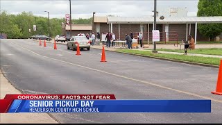 Henderson County High School seniors pick up graduation materials