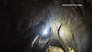 Rescuers search for alternative route to reach 2 missing in a flooded Laos cave