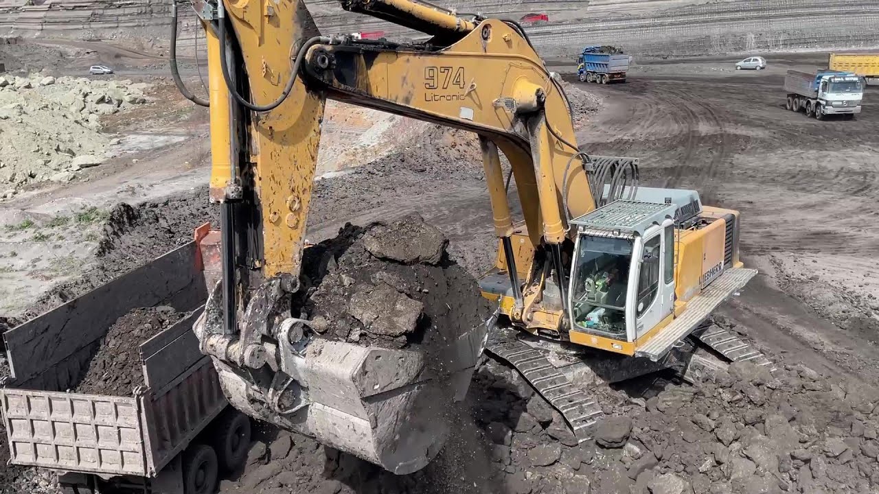 Liebherr 974 Excavator Loading Mercedes And MAN Trucks - Ascon Ltd