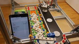 Camera-assisted part feeding directly from a moving conveyor with an industrial delta robot.