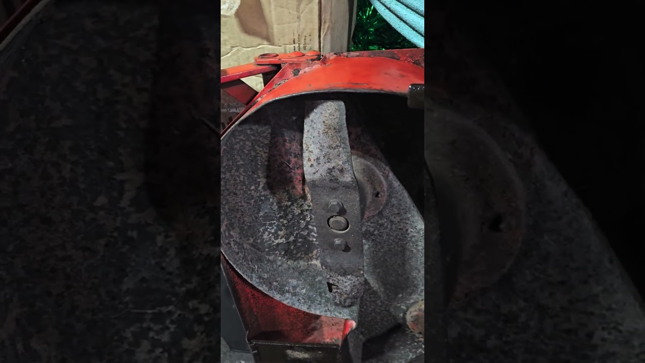 Inspecting Case Ingersoll mower deck before summer rebuild. (Case 224)